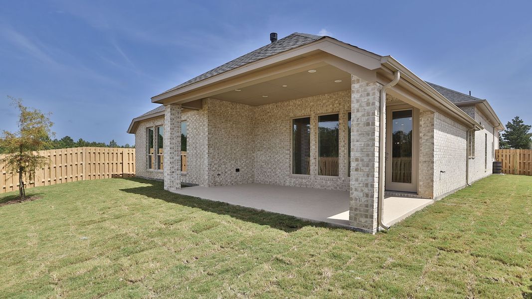 Front exterior of a new home in Colton 55', Montgomery, TX, highlighting curb appeal (Image 2).