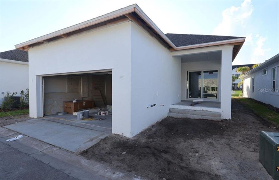 Exterior details and patio area of a home in Emerald Landing at Waterside at Lakewood Ranch – Cottage Series, Sarasota (Image 3).