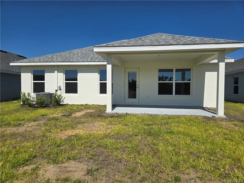 Front exterior of a new home in Wyld Palms, Inverness, FL, highlighting curb appeal (Image 2).
