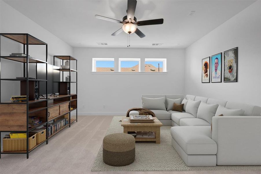 Living room featuring ceiling fan and light carpet