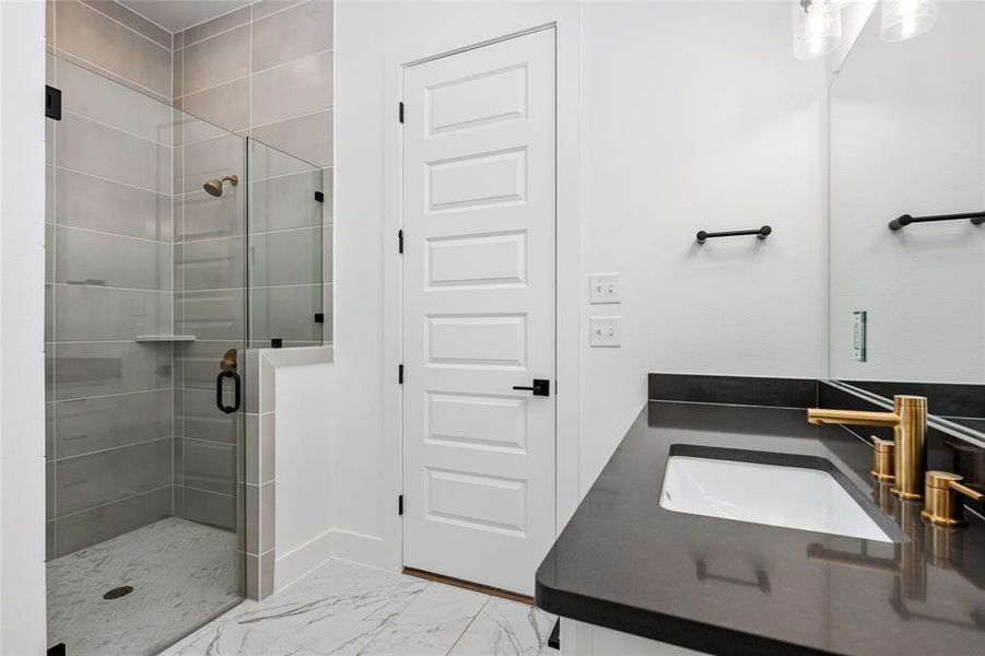 Quartz counter top with gold color faucets