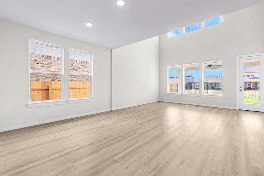 Unfurnished room with light wood finished floors and recessed lighting