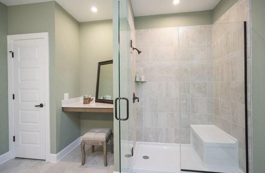 Primary Bath featuring a vanity area and walk-in shower