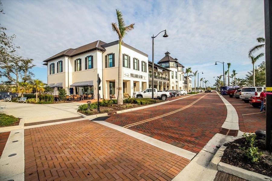 Front exterior of a new home in Sunstone at Wellen Park, Venice, FL, highlighting curb appeal (Image 22).