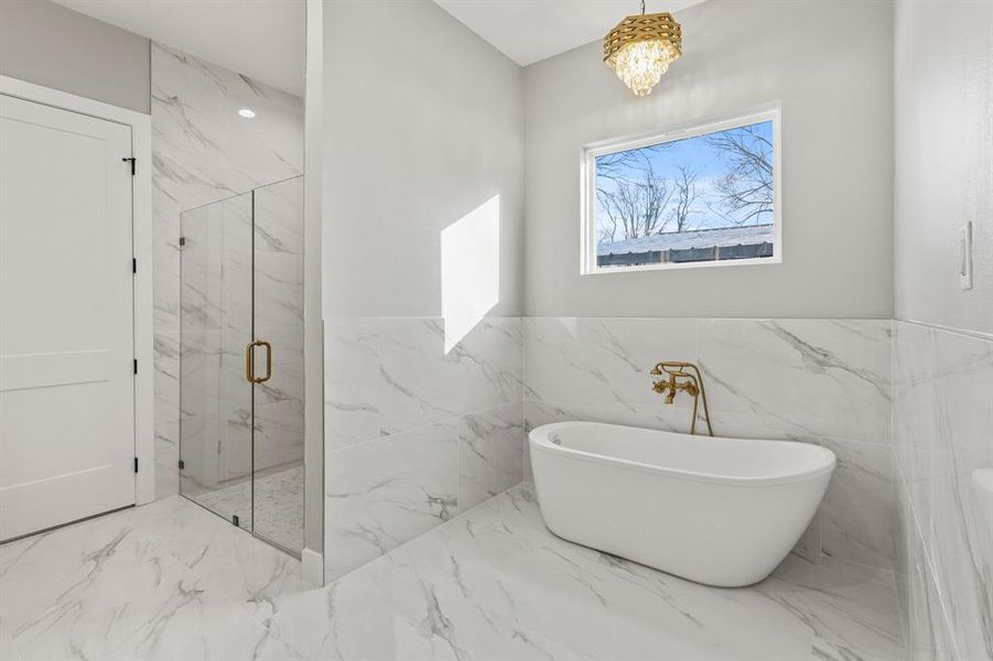 Bathroom featuring separate shower and tub