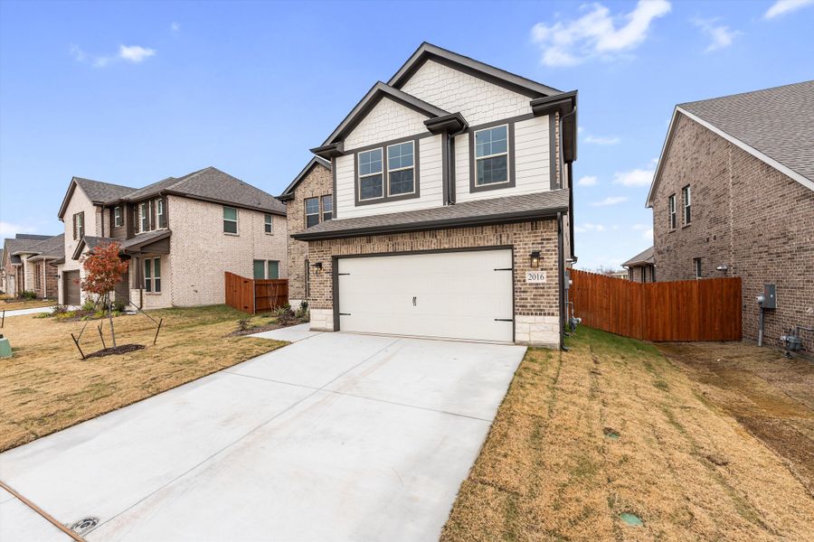 Front exterior of a new home in Northstar, Haslet, TX, highlighting curb appeal (Image 23). Front exterior of a new home in Northstar, Haslet, TX, highlighting curb appeal (Image 23).