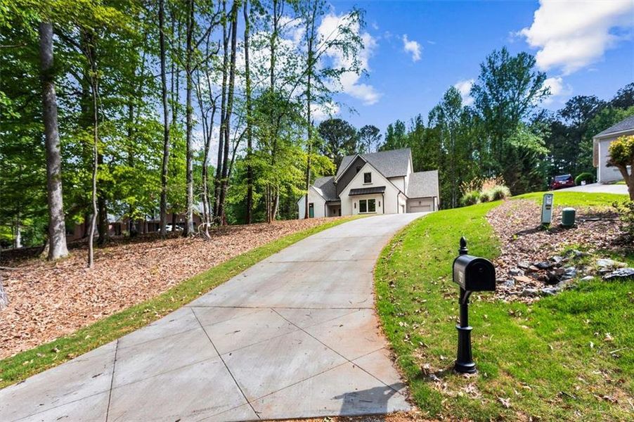 Front exterior of a new home in , Hoschton, GA, highlighting curb appeal (Image 24). Front exterior of a new home in , Hoschton, GA, highlighting curb appeal (Image 24).