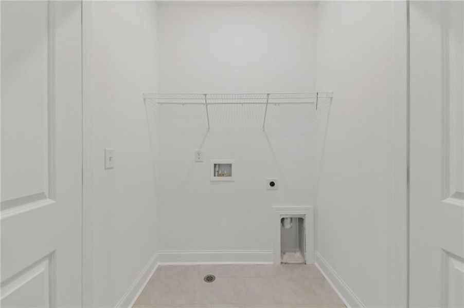 laundry room next to the owners bedroom