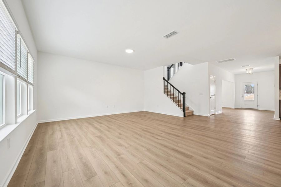 Family Room featuring the AW Collection® Roosevelt - Warm finishes make this room hosting-ready.