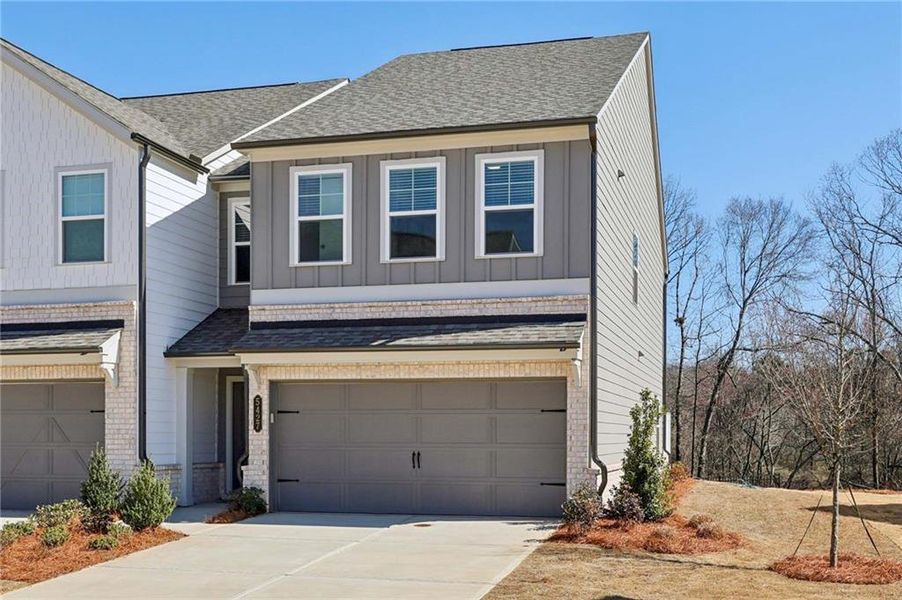 Front exterior of a new home in Eastlyn Crossing, Flowery Branch, GA, highlighting curb appeal (Image 24).