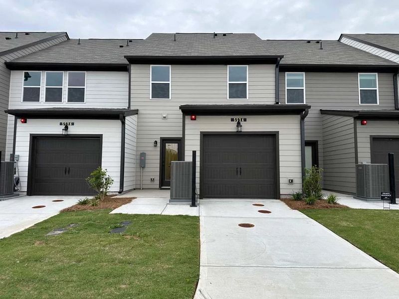 Rear Exterior with One Car Garage