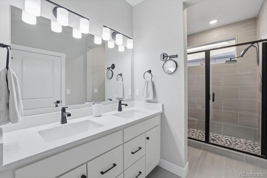 The primary bedroom has a private, ensuite bath.