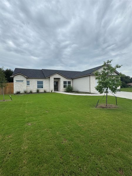Front exterior of a new home in , Thorndale, TX, highlighting curb appeal (Image 22).