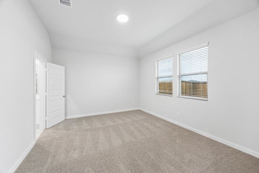 Primary Suite in the Cedar home plan by Trophy Signature Homes – REPRESENTATIVE PHOTO