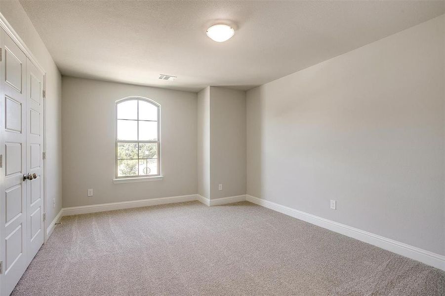 Unfurnished room featuring light carpet and baseboards Unfurnished room featuring light carpet and baseboards