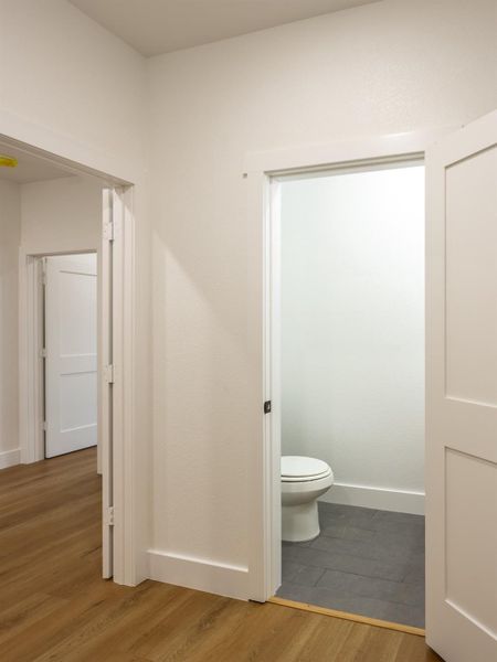 Located conveniently near the common areas, the half-bath is designed with functionality in mind without compromising on style. Located conveniently near the common areas, the half-bath is designed with functionality in mind without compromising on style.