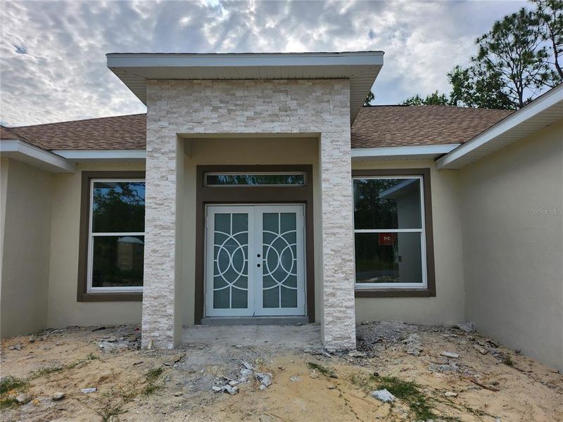 Front exterior of a new home in , Ocala, FL, highlighting curb appeal (Image 1). Front exterior of a new home in , Ocala, FL, highlighting curb appeal (Image 1).