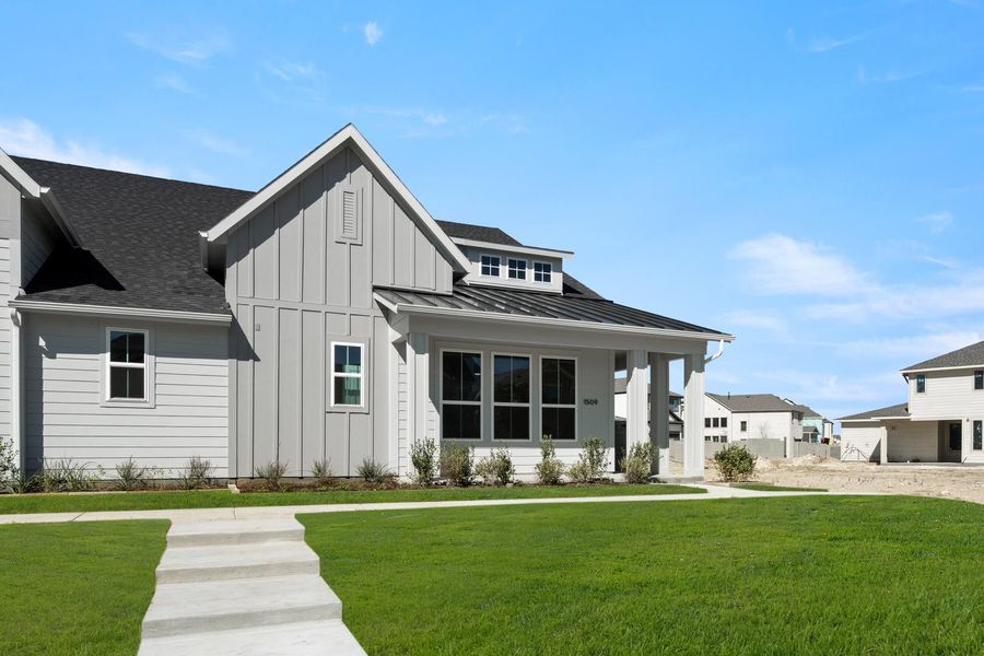 Front exterior of a new home in Terrace Collection at Harvest, Argyle, TX, highlighting curb appeal (Image 2).