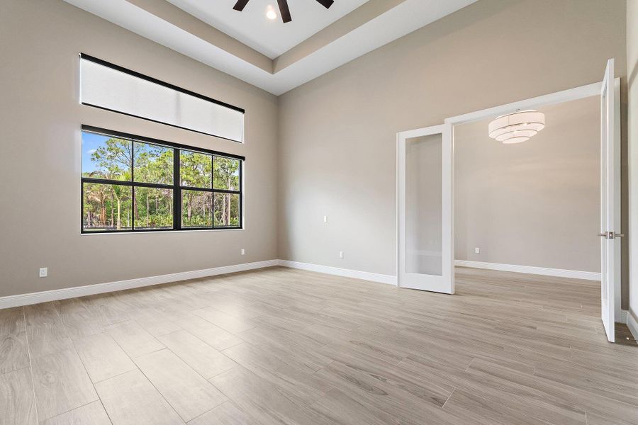 French doors open to spacious den