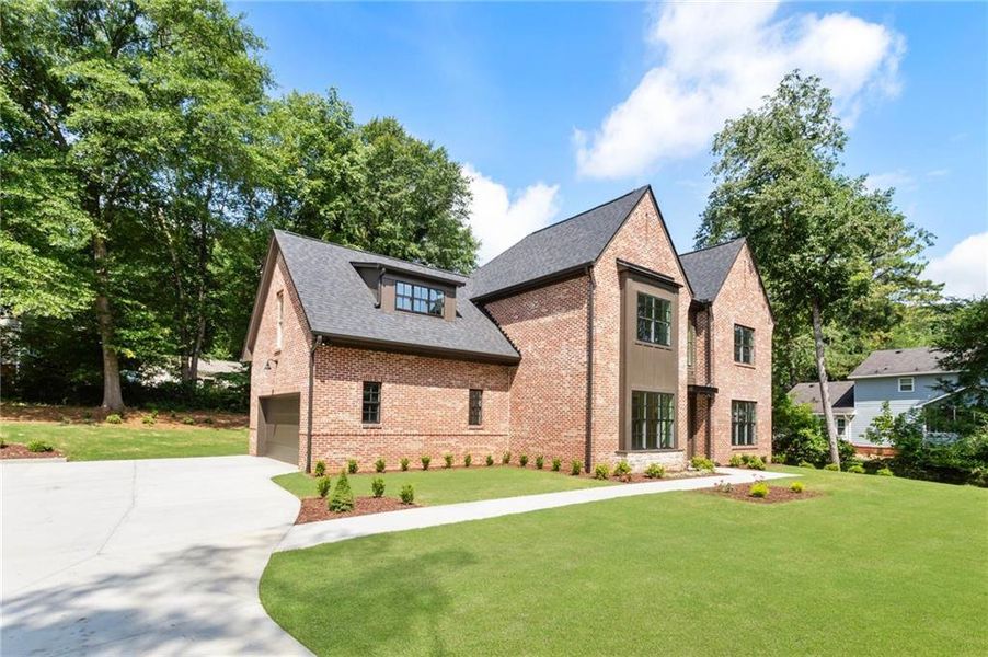 Front exterior of a new home in , Snellville, GA, highlighting curb appeal (Image 25). Front exterior of a new home in , Snellville, GA, highlighting curb appeal (Image 25).