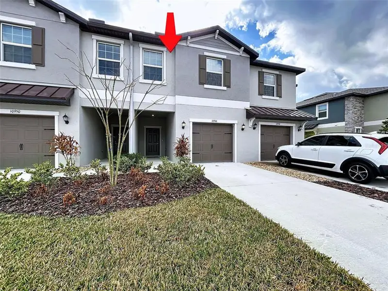 Front exterior of a new home in , Land O' Lakes, FL, highlighting curb appeal (Image 2). Front exterior of a new home in , Land O' Lakes, FL, highlighting curb appeal (Image 2).