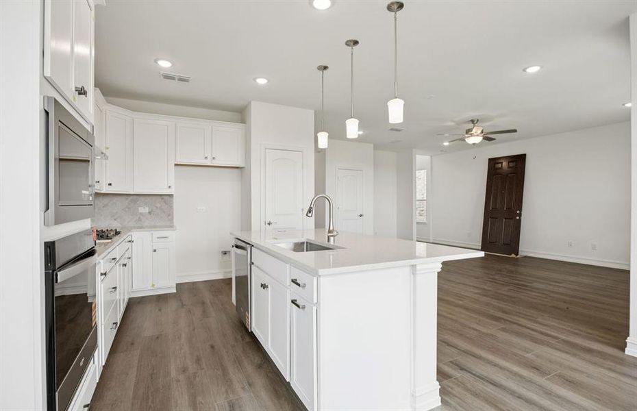 High-end gourmet kitchen with premium finishes and upgraded appliances *Real home pictured High-end gourmet kitchen with premium finishes and upgraded appliances *Real home pictured