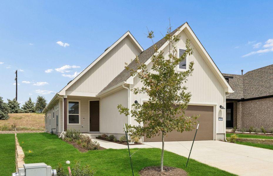 Front exterior of a new home in Sun City Texas, Georgetown, TX, highlighting curb appeal (Image 17). Front exterior of a new home in Sun City Texas, Georgetown, TX, highlighting curb appeal (Image 17).