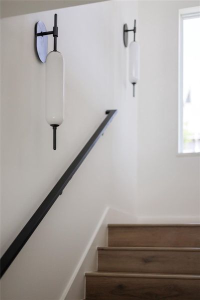 CUSTOM metal and glass lighting guides you up the stairway to the living and bedroom areas. Metal hand rail and 6" base boards. CUSTOM metal and glass lighting guides you up the stairway to the living and bedroom areas. Metal hand rail and 6" base boards.