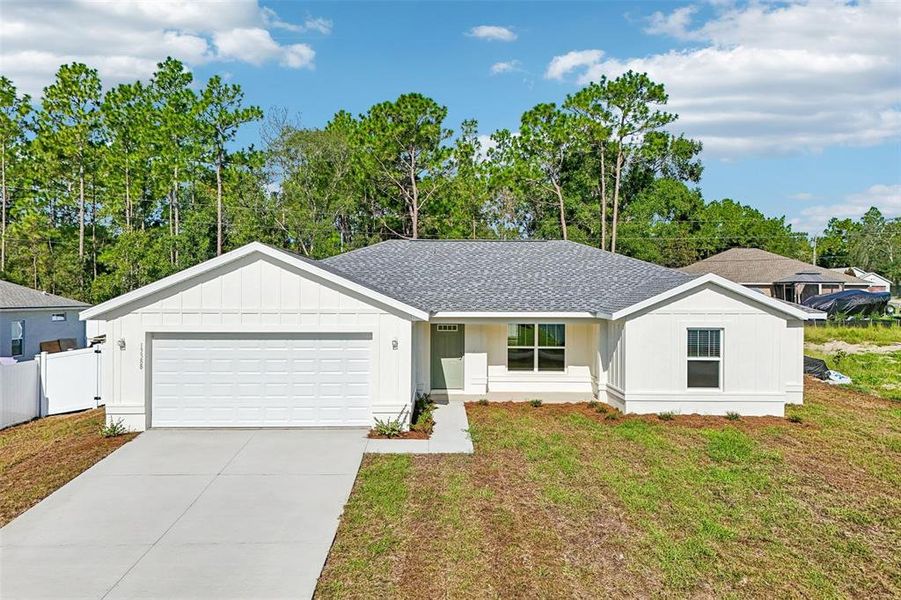 Front exterior of a new home in , Ocala, FL, highlighting curb appeal (Image 2). Front exterior of a new home in , Ocala, FL, highlighting curb appeal (Image 2).