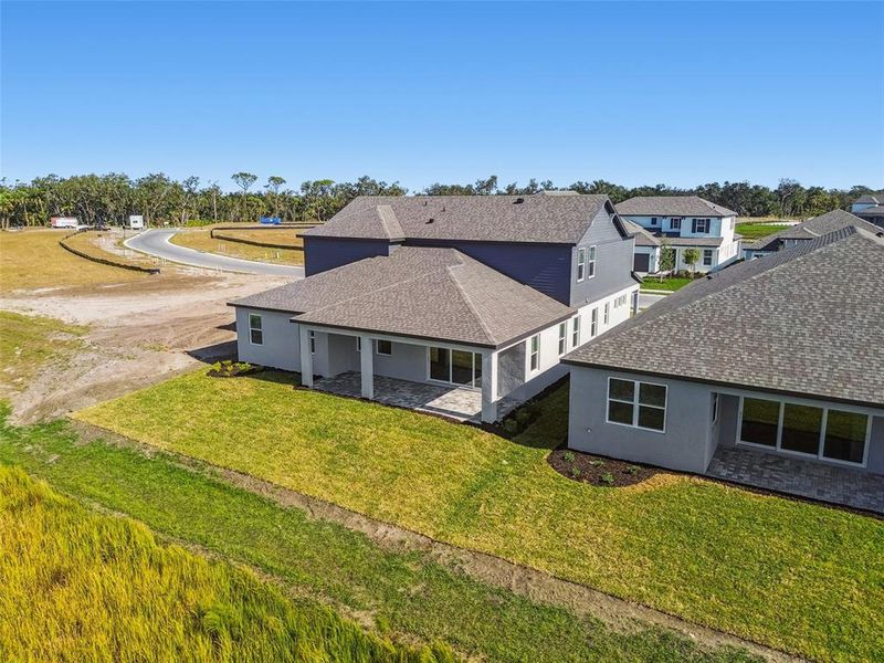 Exterior details and patio area of a home in Creeks Edge at Twin Rivers, Parrish (Image 30).