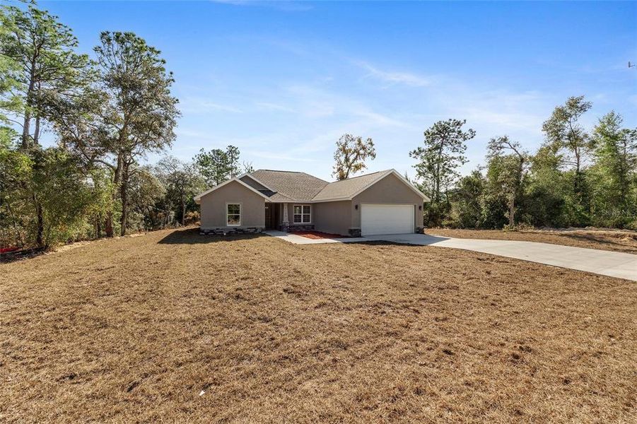 Front exterior of a new home in , Citrus Springs, FL, highlighting curb appeal (Image 18).