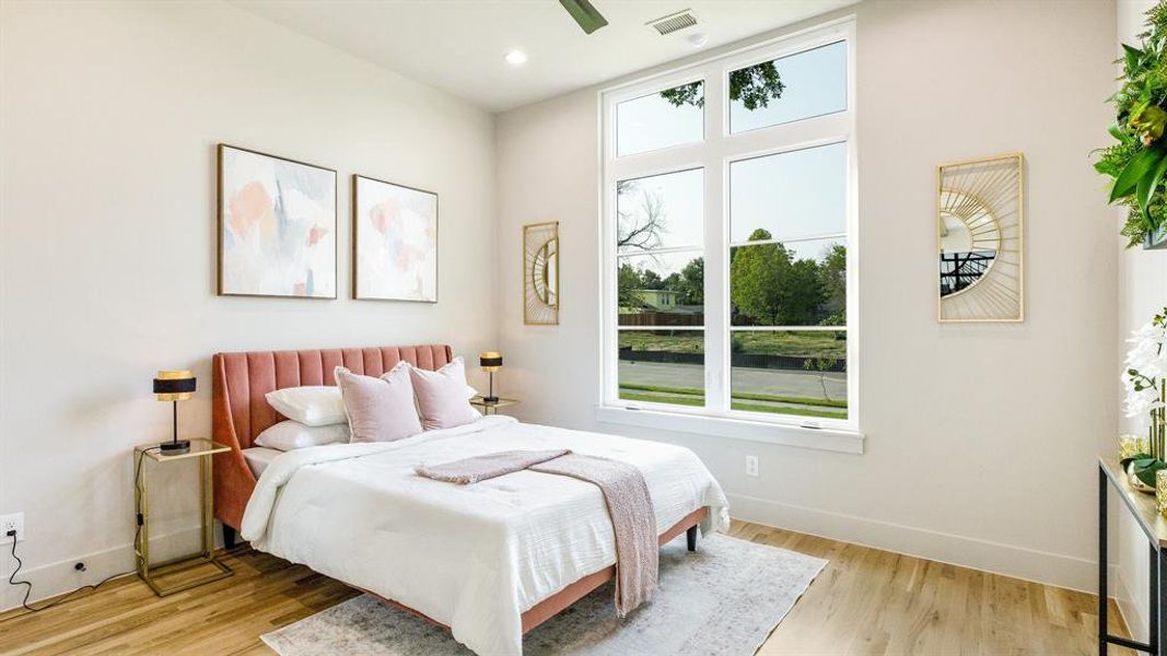 Bedroom featuring ceiling fan and light hardwood / wood-style floors