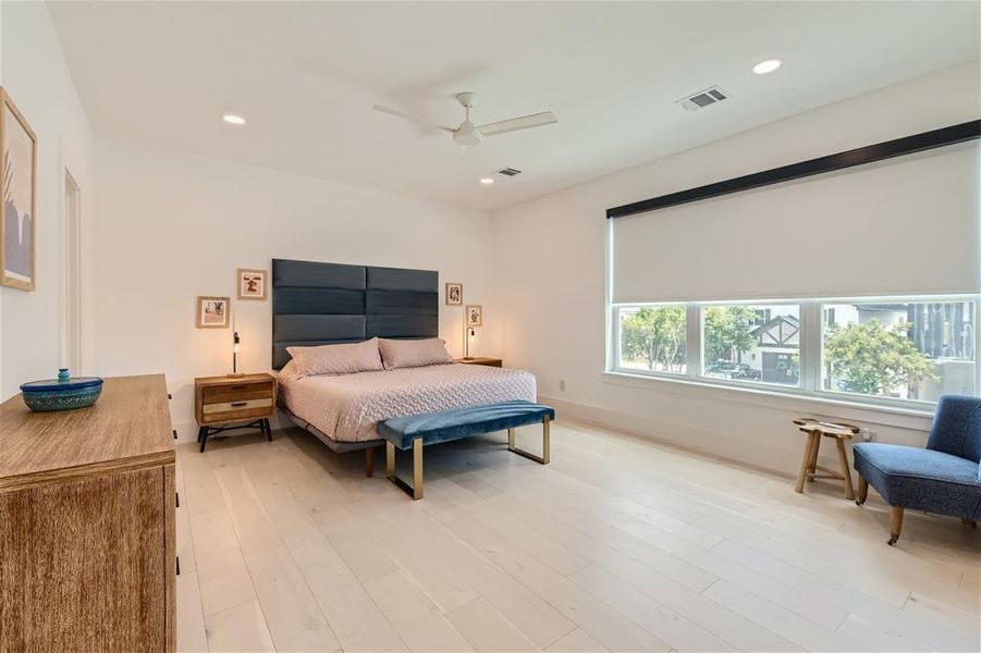 Primary Bedroom features motorized window treatments.