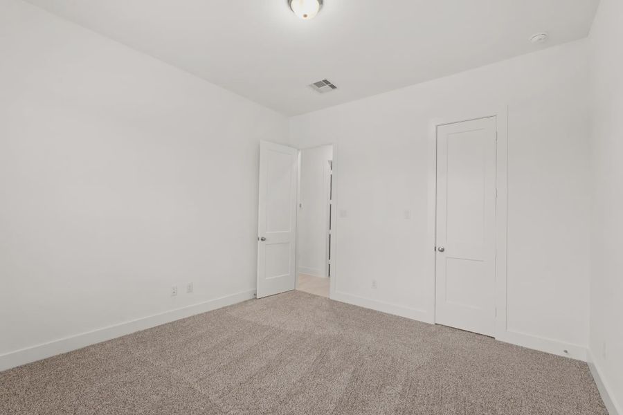 Representative unfurnished interior of a home built from the Mickelson by Chesmar Homes in Riceland Alley Loads, Mont Belvieu (Image 96).