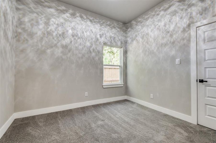 Empty room featuring carpet Empty room featuring carpet