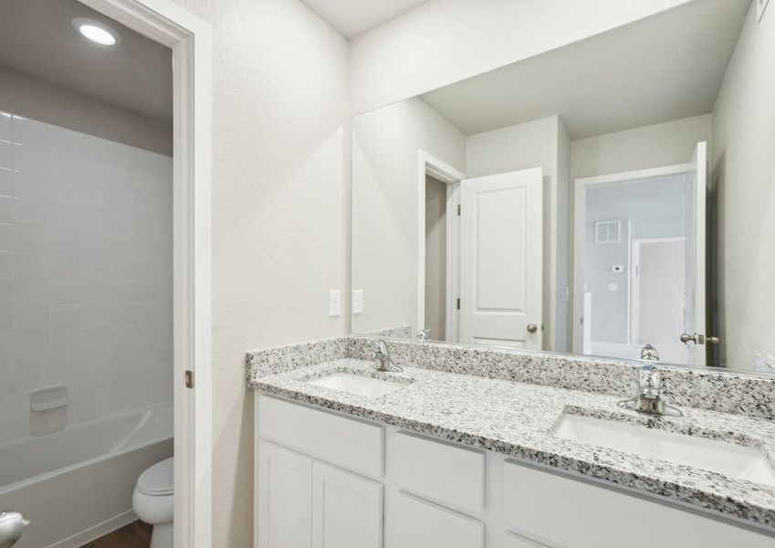 The secondary bathroom has a tub/shower combo.