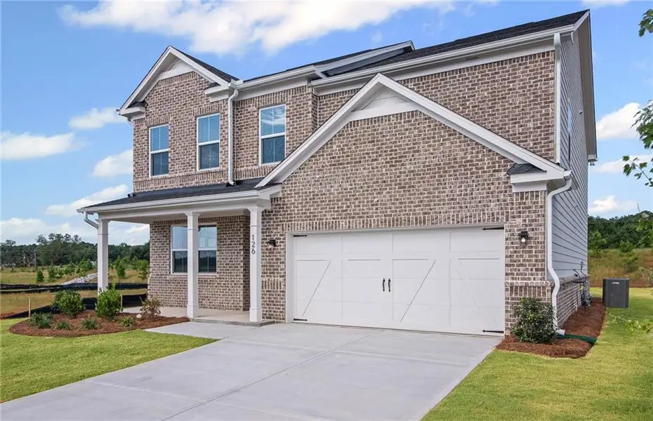 Front exterior of a new home in Overland, Locust Grove, GA, highlighting curb appeal (Image 20).