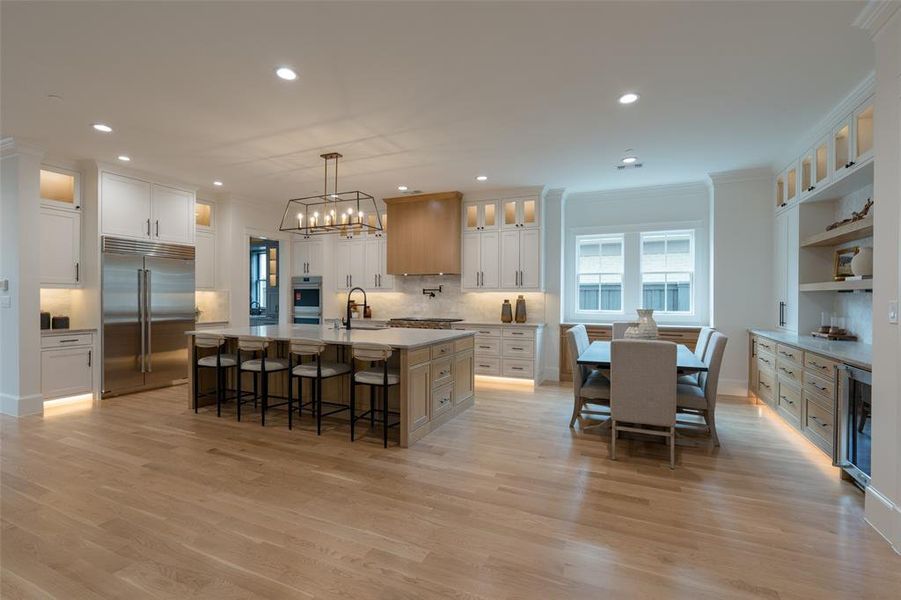 Kitchen and dining nook area with custom cabinets.