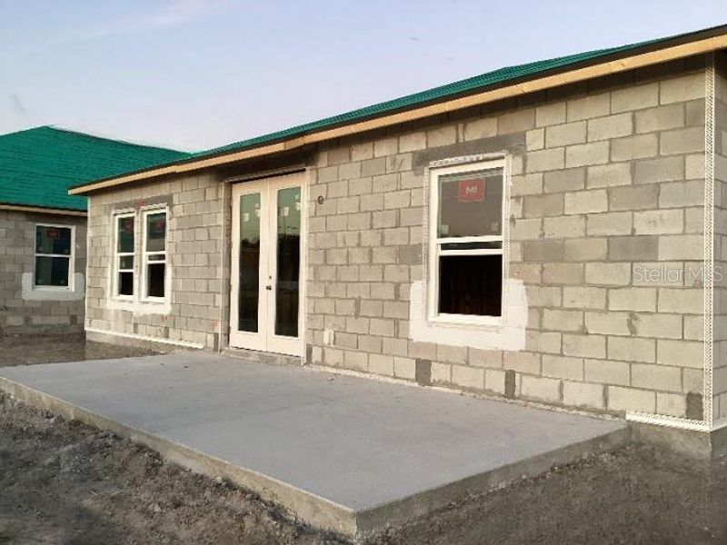 Exterior details and patio area of a home in Catamaran Cove Traditional, Rockledge (Image 5).