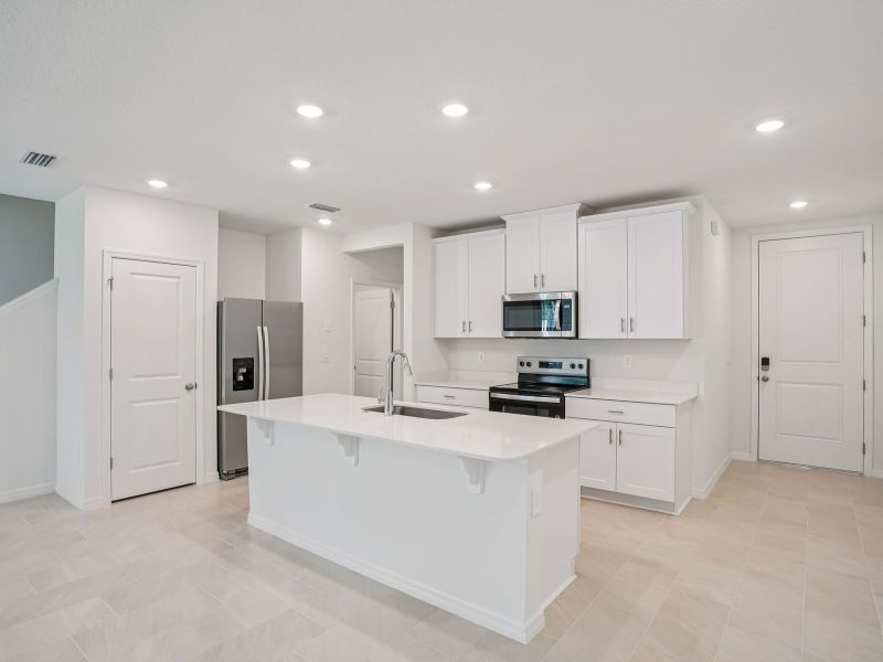 Furnished interior view inside a new home in The Meadow at Crossprairie Townes, St. Cloud (Image 3).