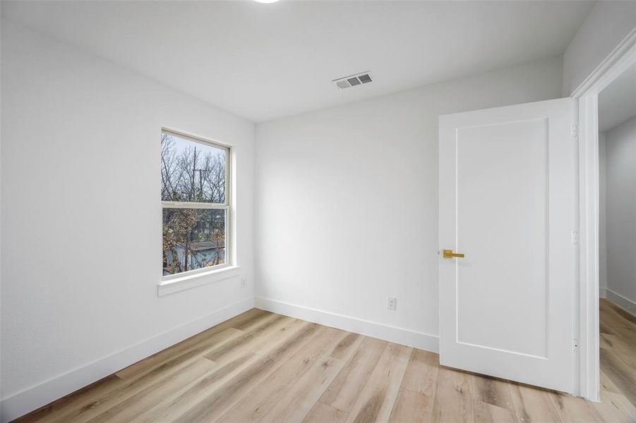 Spare room with light hardwood / wood-style flooring