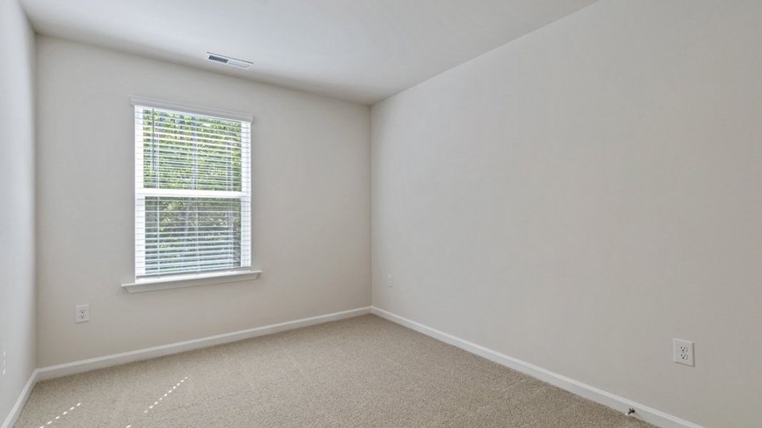 Spacious, unfurnished interior of a new home in Edinborough Townes, Gibsonville (Image 14).