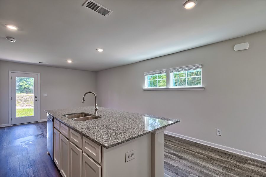 Representative furnished interior of a home built from the Juniper by McGuinn Homes in Hunters Branch, Hopkins (Image 5).