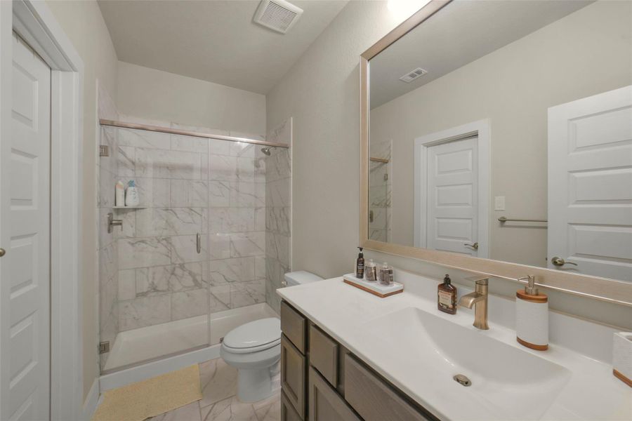 Well appointed secondary bathroom with modern finishes.