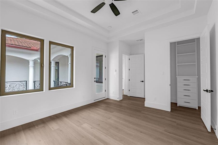 Bedroom 3 with access to the wrap-around balcony overlooking the courtyard. All bedroom closets have built-in dressers, shelves and rods Bedroom 3 with access to the wrap-around balcony overlooking the courtyard. All bedroom closets have built-in dressers, shelves and rods