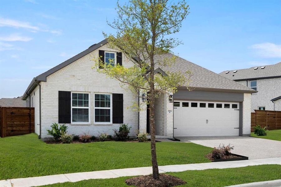 Front exterior of a new home in Solterra, Mesquite, TX, highlighting curb appeal (Image 27).