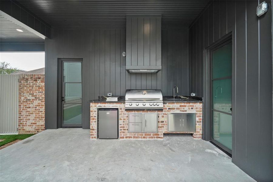 A nice view from the pool of the outdoor kitchen.