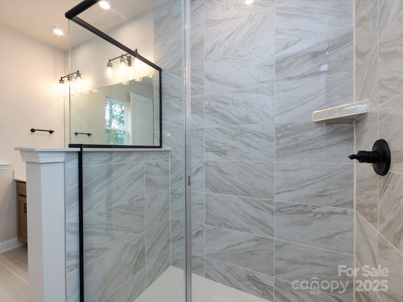 Walk-In Primary Shower with Modern Tile Surround.
