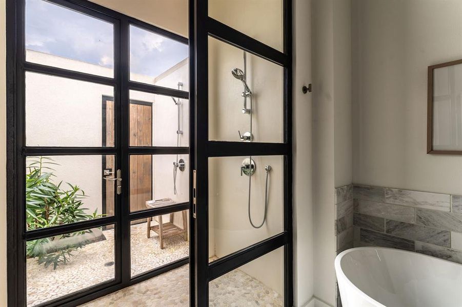 Bathroom featuring a freestanding tub and double vanity Bathroom featuring a freestanding tub and double vanity
