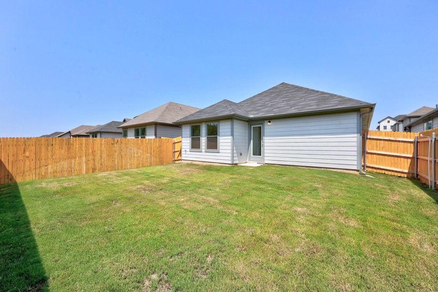 Exterior details and patio area of a home in Trinity Ranch, Elgin (Image 2). Exterior details and patio area of a home in Trinity Ranch, Elgin (Image 2).